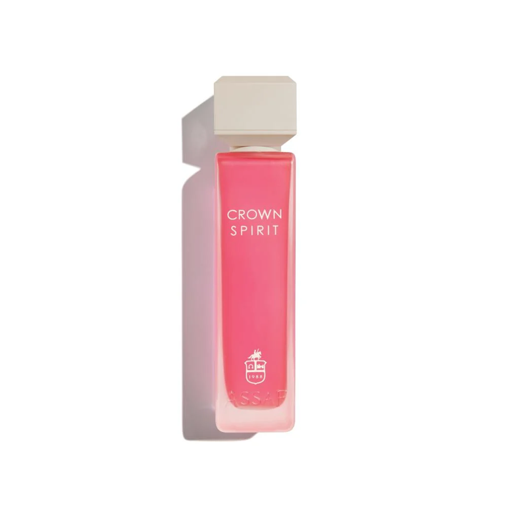 Assaf Crown Spirit perfume bottle with a tall clear glass body filled with vibrant coral-pink fragrance, square beige cap.