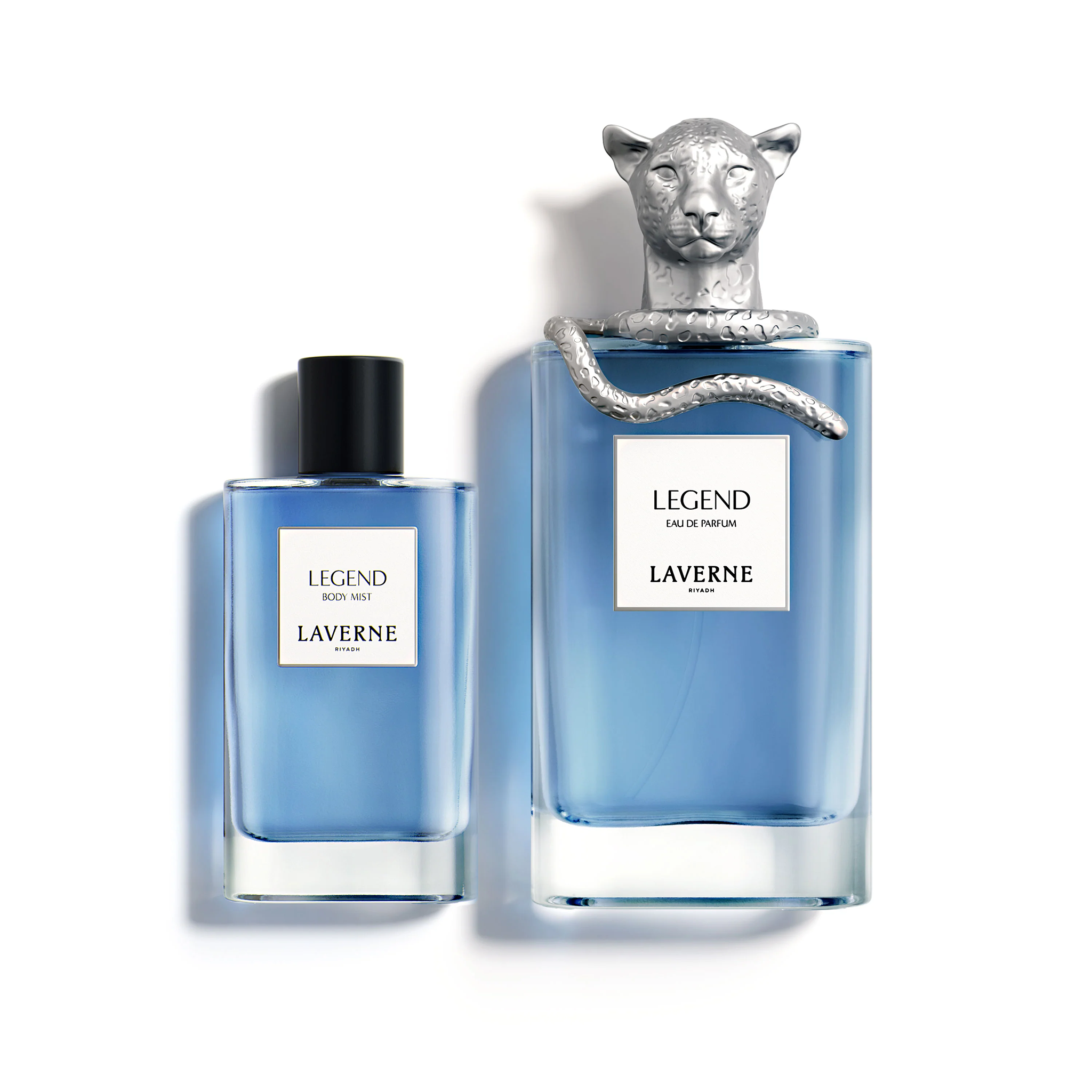 Laverne Legend Eau De Parfum and body mist bottles in blue glass, featuring a sculpted silver panther cap.