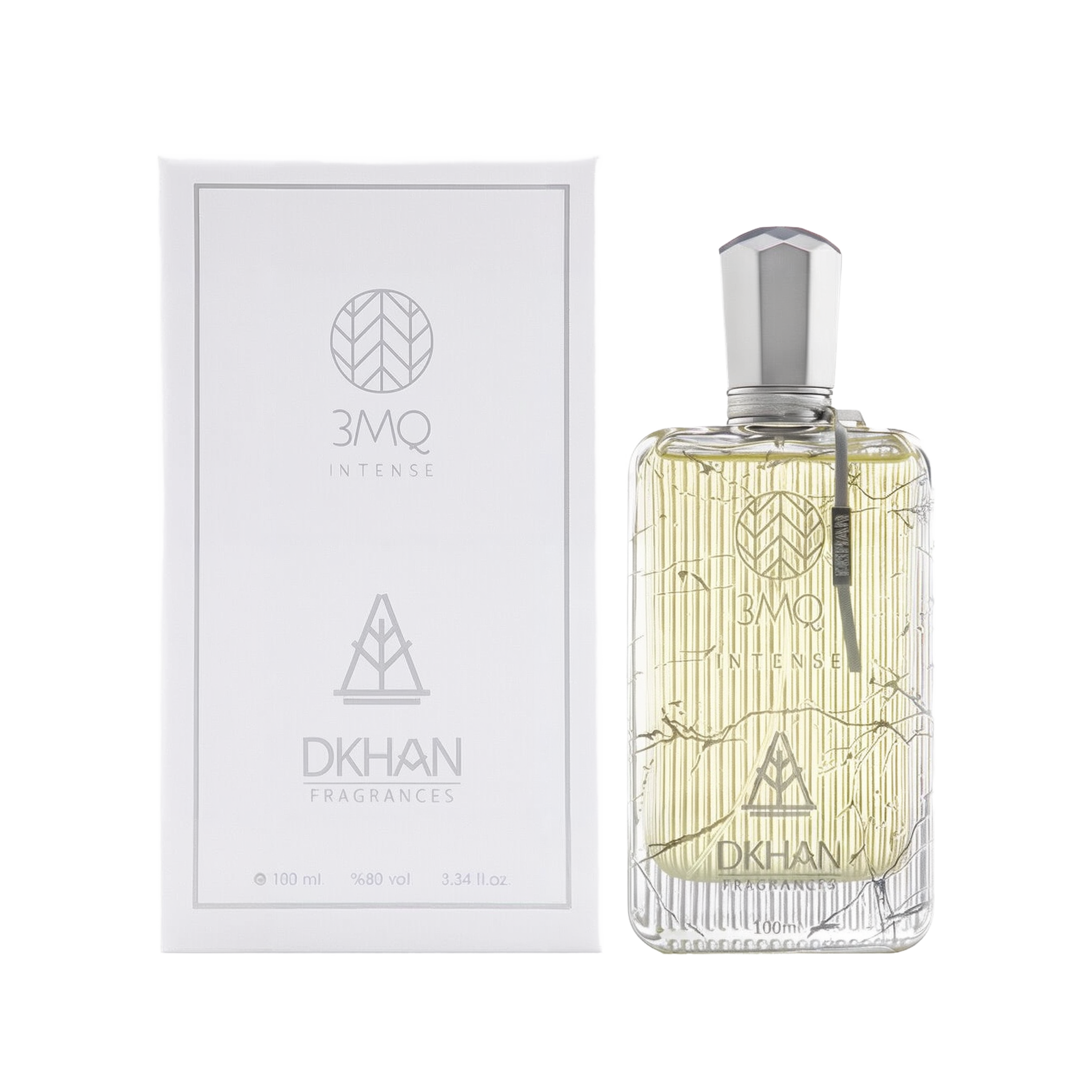 The image shows a luxurious clear glass perfume bottle with a silver cap, engraved with intricate, geometric patterns and the branding "3MQ INTENSE" in the center. To the left, the white packaging box echoes the bottle's design, with "3MQ INTENSE" and "DKHAN FRAGRANCES" emblems in a sleek, modern font. Both the bottle and box indicate the volume "100 ml", alcohol content "98% vol", and size "3.34 fl. oz." 
