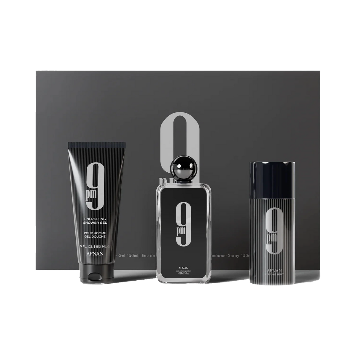 A sleek and modern fragrance gift set by Afnan Perfumes, labeled "9 PM." The set includes three items: on the left is an energizing shower gel (150 ml) in a black tube with white text, in the center is a rectangular black perfume bottle with a glossy fini