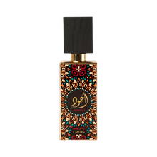 Image of a perfume bottle with a distinctive design. The bottle features a geometric and floral pattern in orange, black, and teal, with a circular black label in the center that has gold Arabic calligraphy and the word 'AJWAD' beneath it. The brand 'Lattafa' is written at the bottom. The cap is black with a textured appearance, resembling wood, and a gold neck. The background is pure white.