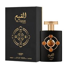 This image shows the packaging and bottle for "Al Qiam Gold" Eau de Parfum by Lattafa Pride.  A gold geometric design is featured in the center of the box, which mirrors the design on the bottle. The box also states "Lattafa Pride," the volume "100mL" and