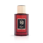 The image presents a dark red glass perfume bottle with a gold cap. The front label features elegant Arabic calligraphy above English text stating "Sandalwood," which is the fragrance name. It is from the brand Ibraheem Al Qurashi. The bottle is set against a plain white background, highlighting its design and color. The focus on the bottle without additional elements suggests a minimalist or elegant presentation, emphasizing the perfume itself.