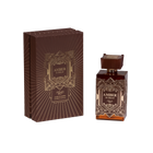 A perfume product set titled "AMBER IS GREAT," featuring a square glass bottle with brown tones and intricate geometric patterns. The cap matches the bottle's design. Accompanying the bottle is a similarly patterned brown box with gold line art and lettering, stating "AMBER IS GREAT" at the center, and the brand "náyá" at the bottom. The background is white.