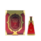 A red-and-gold rectangular box labeled 'Amber Pure' stands beside a matching red glass perfume bottle with ornate gold accents and 'Khadlaj' branding.