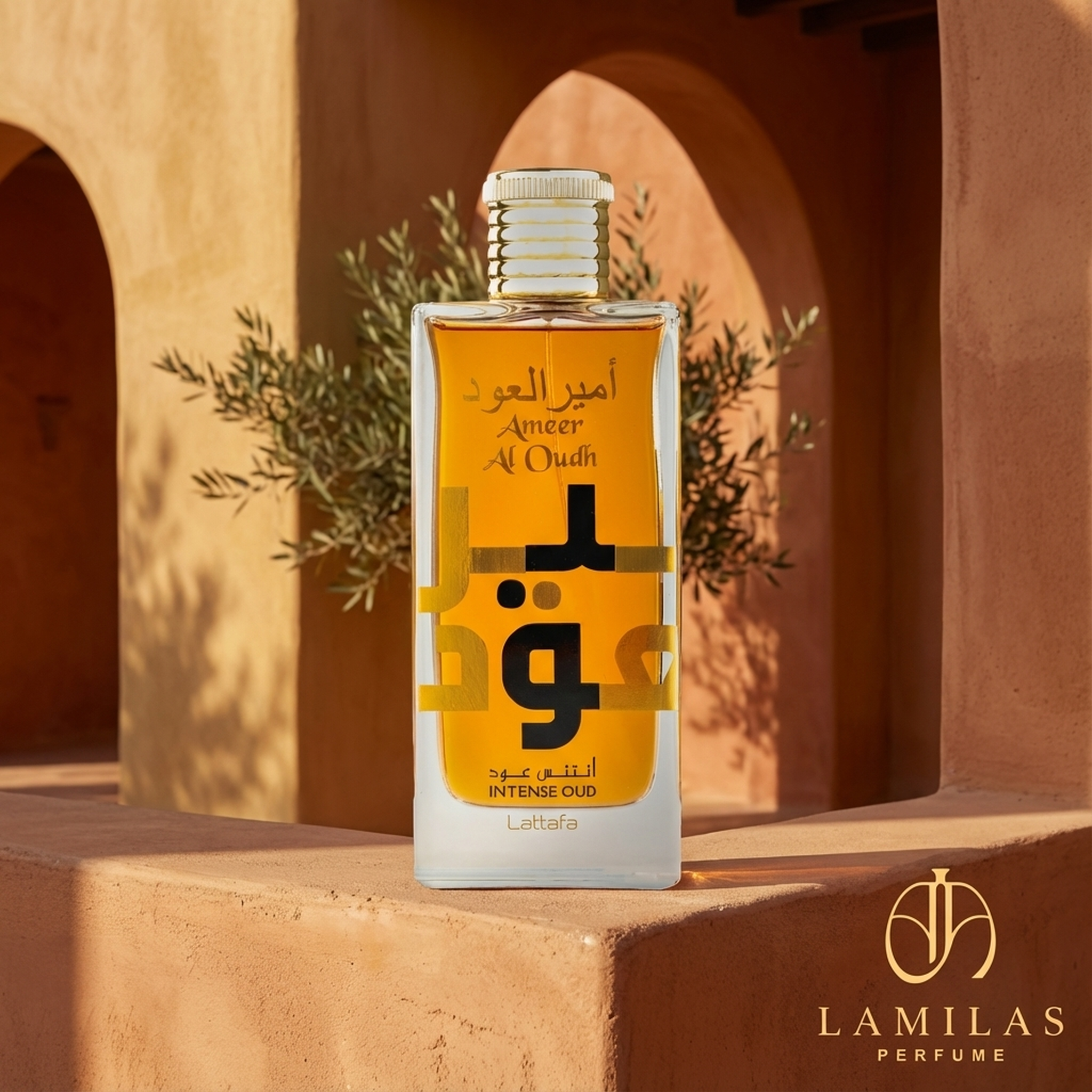 Lattafa Ameer Al Oudh Intense Oud perfume bottle with amber liquid and a gold cap, set against warm terracotta arches.