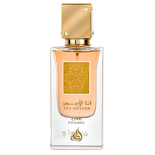 Lattafa Ana Abiyedh Poudrée perfume bottle with gold cap and peach liquid in a clear glass design.