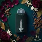 Lattafa Art of Arabia I perfume box featuring a silver Burj Khalifa, framed by oud chips, vanilla, rose, and jasmine.