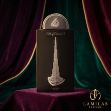 Lattafa Art of Arabia I perfume packaging; black box adorned with a silver relief of the Burj Khalifa on purple velvet.
