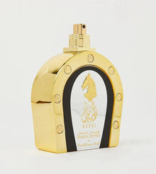 This image shows a perfume bottle from the ASEEL "Special Edition" by Arabian Oud. The bottle is gold-colored with a distinctive arch shape and black side accents that include circular gold details. The central part of the bottle features a white oval with a gold silhouette of a horse's head and the name "ASEEL" written in both Arabic calligraphy and English script. Below the name, "SPECIAL EDITION by Arabian Oud" is printed.