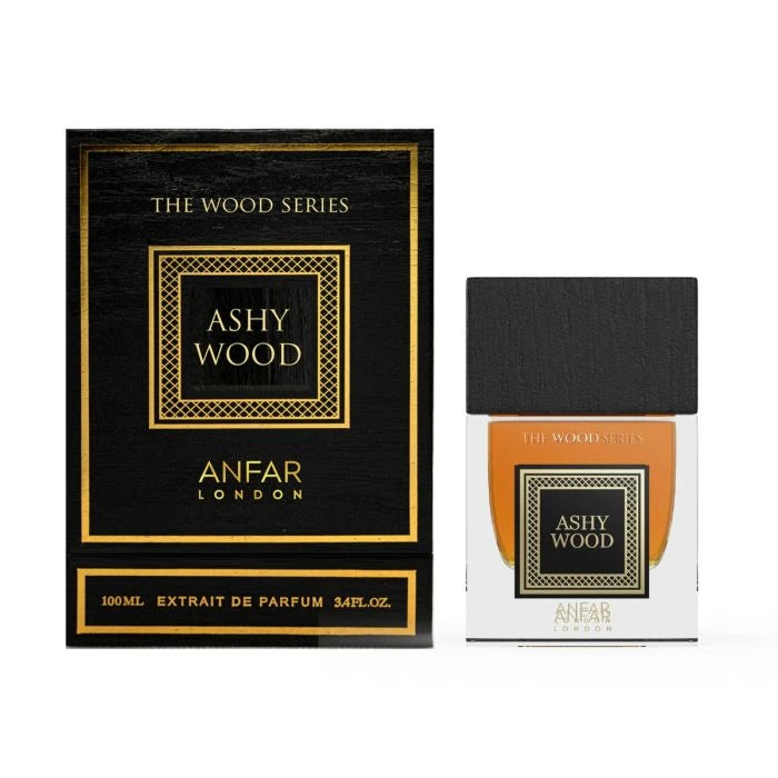 The image shows a product named "Ashy Wood" from the "The Wood Series" by Anfar London. The packaging is sleek and elegant, featuring a black box with golden accents and a geometric design framing the product's name. The text "Ashy Wood" is displayed in a