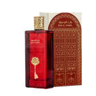 The image features a rectangular perfume bottle with a deep red hue and a highly ornate gold cap. On the bottle is an embossed golden emblem in the shape of a key, which adds to the luxurious appearance of the product. Accompanying the bottle is a box with Arabic and English text, "??? ?????? / BAB AL HAMRA," likely the name of the fragrance.  The product appears to be of Middle Eastern origin and suggests a fragrance with a rich and exotic scent.