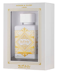 This image displays a perfume package with a white rectangular box that has a window showing the bottle inside. The box is labeled "HONOR & GLORY Lattafa" at the top, with intricate gold geometric and floral designs around the window and on the lower part