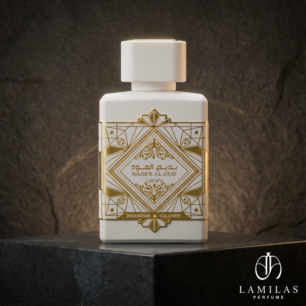 Lattafa Bade'e Al Oud Honor and Glory white perfume bottle featuring an intricate gold geometric design, displayed on black stone.