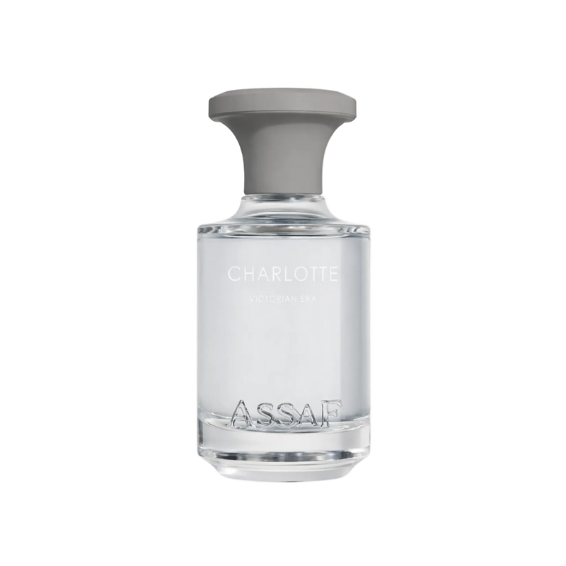 Clear light perfume bottle with grey cap labelled “Charlotte Victorian Era”.
