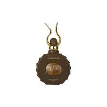 Classic Stone by Niche Emarati Perfumes in a unique round brown bottle with a golden marble center and sculpted gold cap.