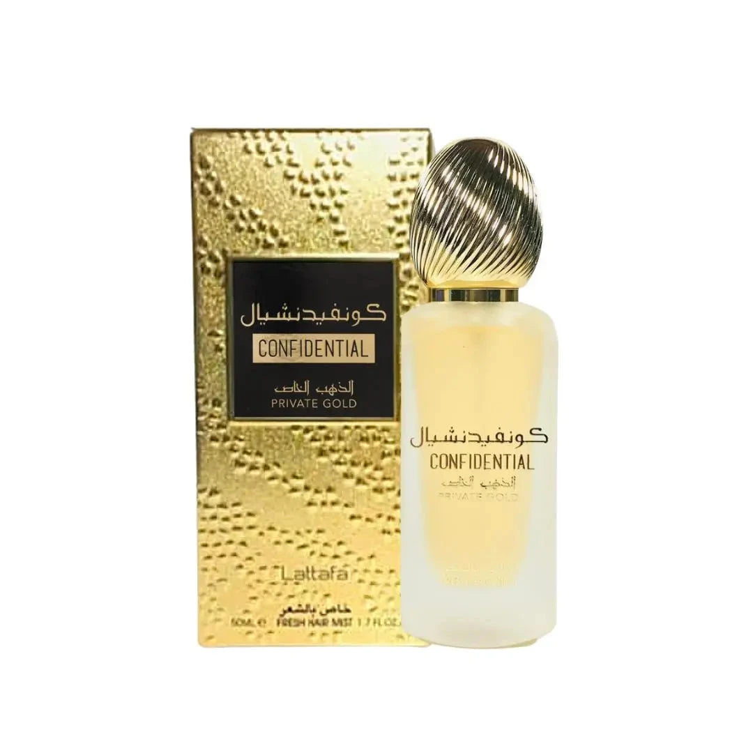 The image displays a fragrance set including a bottle and its packaging box. The bottle has a frosted finish with a gradient from white to a golden hue at the bottom, topped with a metallic gold ribbed cap. It is labeled with "CONFIDENTIAL," as well as "PRIVATE GOLD" beneath the larger text. The accompanying box has a reflective gold finish and features a black label with "CONFIDENTIAL" and "PRIVATE GOLD". The box also includes additional text indicating a 50 ml volume or "FRESH HAIR MIST 1.7 FL.OZ.