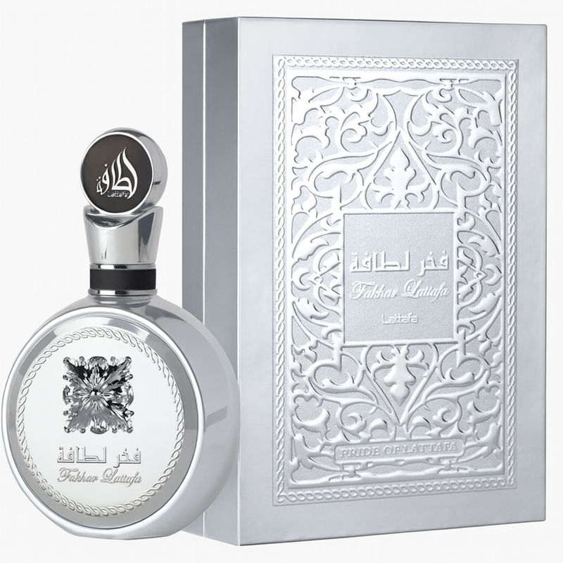 Fakhar Lattafa Platinum Eau De Parfum, silver perfume bottle with engraved floral design.