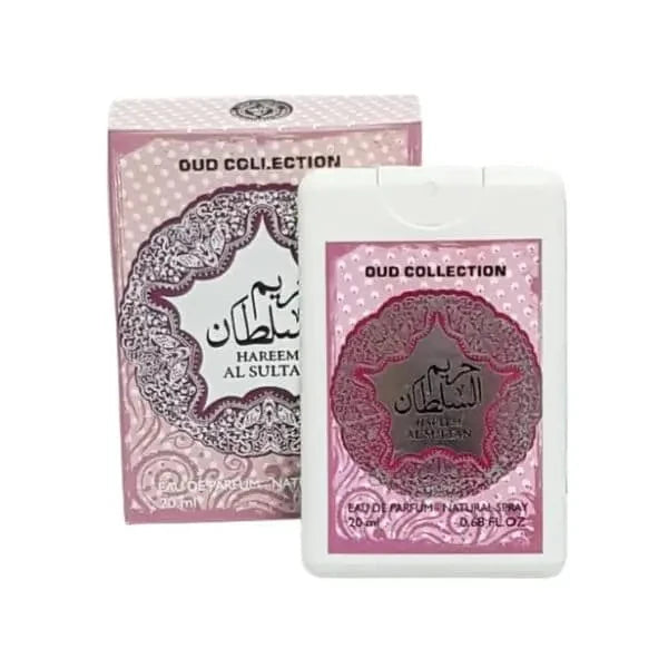  The image shows a product from the "OUD COLLECTION" named "HAREEM AL SULTAN." It includes a pink and white box with intricate lace-like patterns and Arabic calligraphy, alongside a matching white plastic container with a clear window that displays a smaller item inside, possibly a perfume bottle. Both the box and the container feature the same design elements and mention "Eau de Parfum Natural Spray" and the volume "20ml 0.68 FL.OZ." 