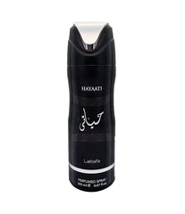 A can of Hayaati Perfumed Body Spray by Lattafa. The 200ml spray features a sleek black design with silver accents, including a silver spray nozzle and horizontal band near the base. The front displays the name "Hayaati" in white text along with Arabic script and the Lattafa logo beneath it. The design has a modern, masculine aesthetic with subtle geometric patterns integrated into the background.