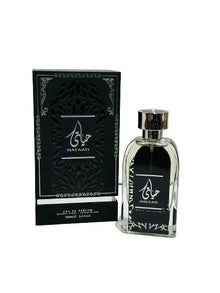 A bottle of Hayaati perfume by Lattafa next to its packaging box. The perfume bottle is clear with a black label featuring the Hayaati logo in white Arabic calligraphy. The box is black with a textured design, silver accents, and the same logo as the bottle.