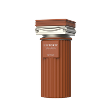 Terracotta ribbed perfume bottle with silver architectural cap and Historic Sahara Afnan branding.