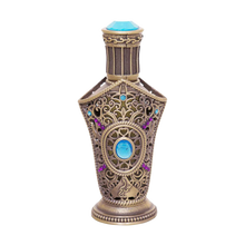 Ibhaar concentrated perfume oil bottle with ornate bronze filigree design and blue gemstone accents.
