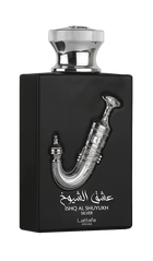The image displays a perfume bottle named "Ishq Al Shuyukh Silver" by Lattafa Pride. The bottle is designed with a matte black finish and features a shiny silver cap. The front of the bottle is adorned with a detailed silver sculpture of a traditional Ara