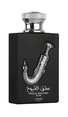The image displays a perfume bottle named "Ishq Al Shuyukh Silver" by Lattafa Pride. The bottle is designed with a matte black finish and features a shiny silver cap. The front of the bottle is adorned with a detailed silver sculpture of a traditional Ara