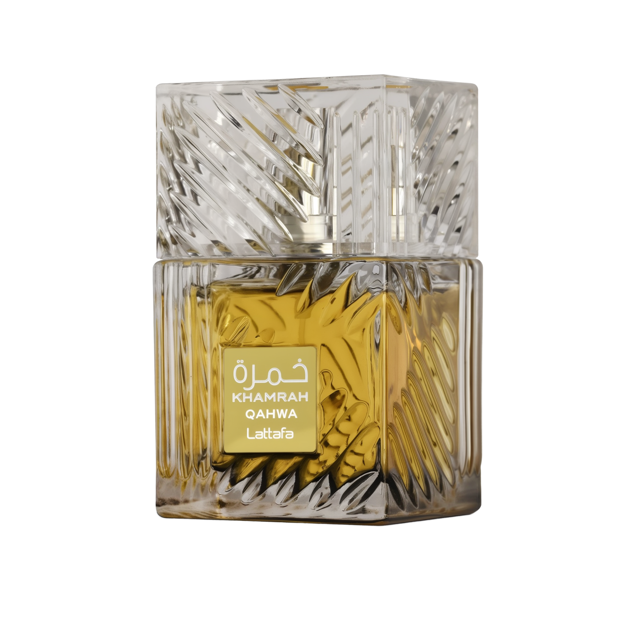 This image presents a close-up of a square perfume bottle from Lattafa, named "KHAMRAH QAHWA". The glass bottle has a detailed, faceted design that gives a sense of luxury and complexity. The perfume liquid inside is a deep, golden yellow, suggesting a rich and possibly warm scent. The bottle has a clear glass cap that matches the overall design. On the front of the bottle, there is a rectangular, golden label with the perfume's name "KHAMRAH" and "QAHWA" below it, as well as the brand name "Lattafa".