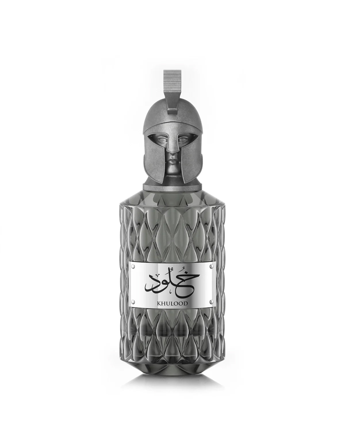 A product shot of Le Falcone Niche Collection’s “Khulood” perfume bottle on a white background: a tall, amber‑colored glass vessel with a diamond‑cut texture and a polished bronze plaque engraved with Arabic calligraphy above the word “Khulood.” The bottle is crowned by an ornate bronze cap sculpted into a stylized warrior’s helmet with a crest‑style loop at the top, conveying a luxurious, sculptural aesthetic.