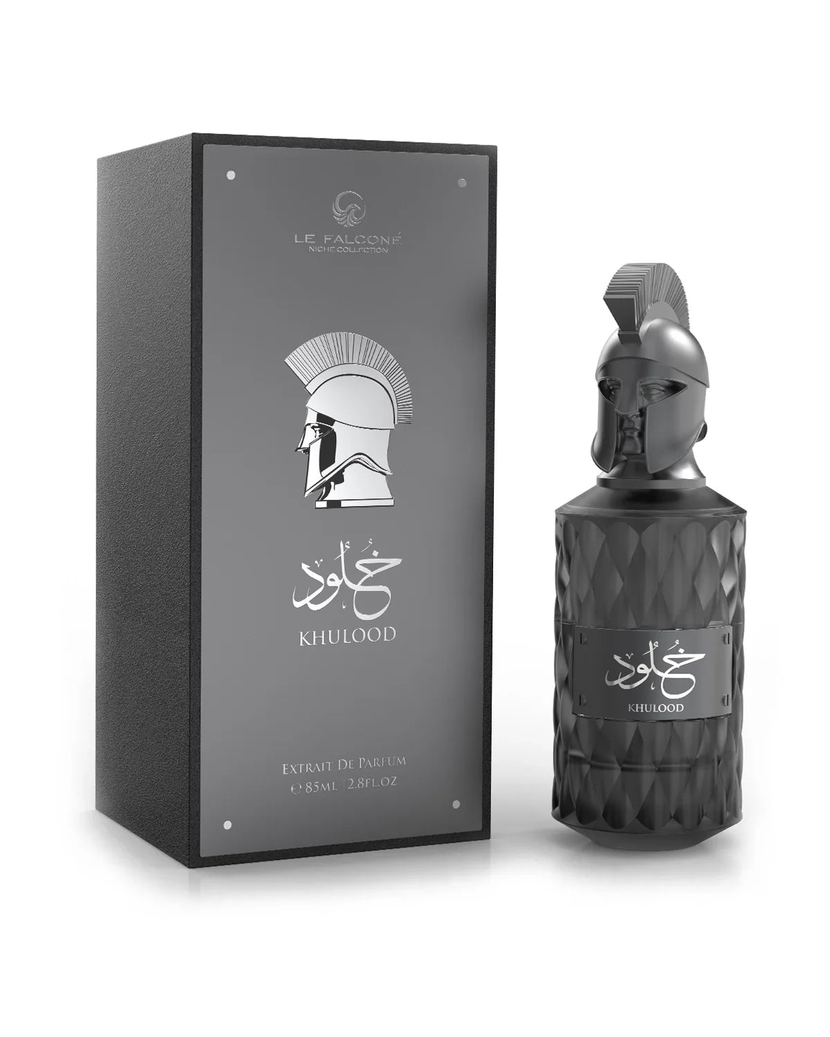 Le Falcone Niche Collection’s “Khulood” perfume against a white background: on the left, a closed matte‑dark rectangular gift box with a glossy silver‑tone front panel featuring the Le Falcone logo, a stylized warrior‑helmet graphic, Arabic calligraphy and the word “Khulood,” plus “Extrait de Parfum 85 ml / 2.8 fl oz” printed below. On the right, the box is opened to reveal the perfume bottle resting on a raised beige interior platform.