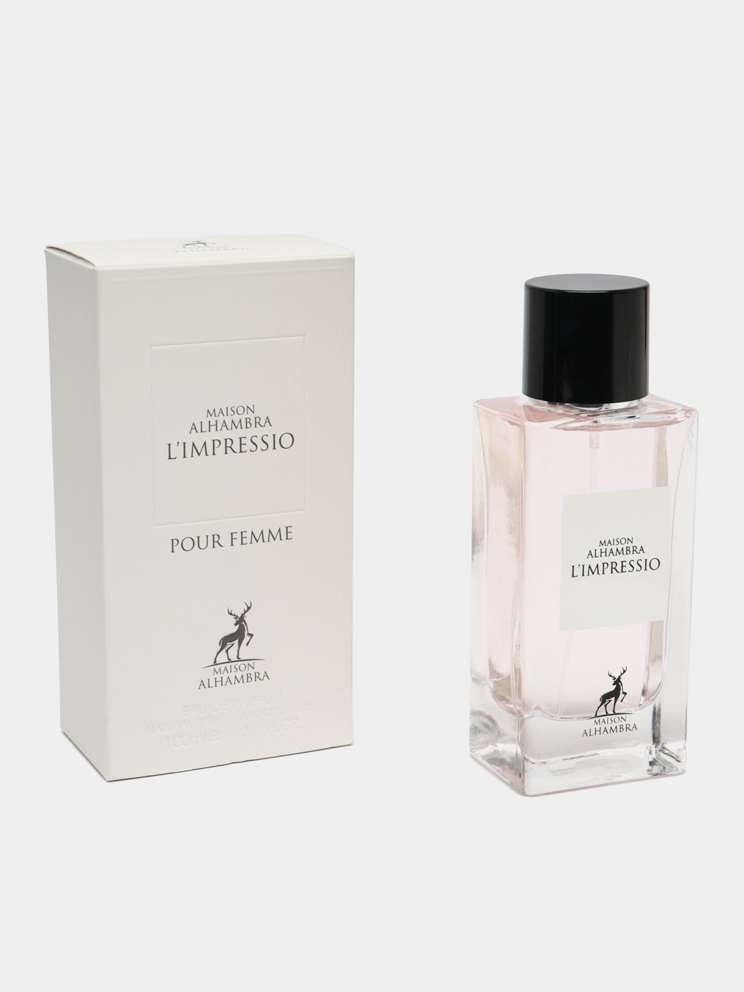 A product image of Maison Alhambra’s “L’Impressio Pour Femme” perfume: a tall, rectangular off‑white gift box printed in simple black serif font with “Maison Alhambra L’Impressio” at the top, “Pour Femme” beneath, and a small stylized stag logo above “Maison Alhambra” at the bottom. Beside it stands a clear rectangular glass bottle filled with pale pink fragrance, topped by a glossy black cylindrical cap.