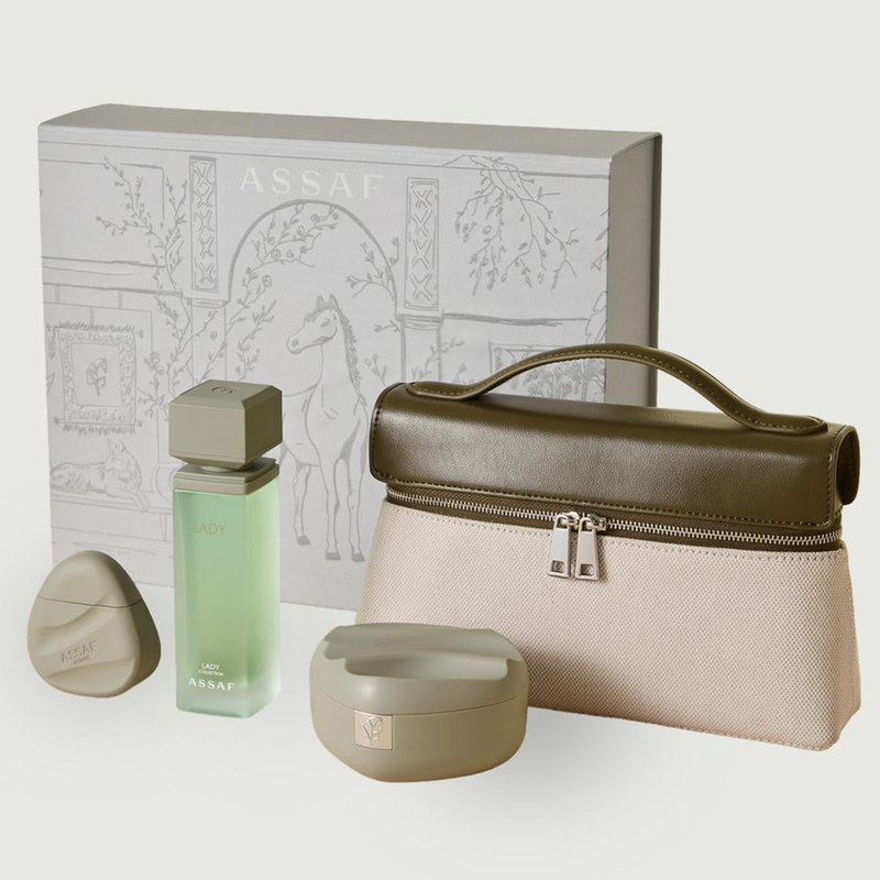 Assaf Lady perfume gift set with green bottle, accessories, and beige cosmetic bag.