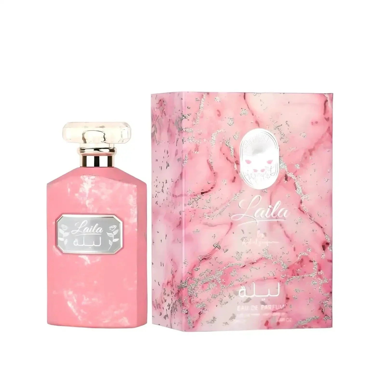 The image displays a perfume bottle alongside its packaging. The bottle on the left has a flat, rectangular shape with a pink marbled or distressed texture and a clear, rectangular glass cap. It features a silver-framed label with the name "Laila" in a stylized font, with Arabic script below it. The box also states "Eau de Parfum" and appears to have silver floral patterns and splashes across it, complementing the overall feminine and luxurious theme of the product. 