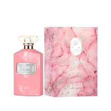 The image displays a perfume bottle alongside its packaging. The bottle on the left has a flat, rectangular shape with a pink marbled or distressed texture and a clear, rectangular glass cap. It features a silver-framed label with the name "Laila" in a stylized font, with Arabic script below it. The box also states "Eau de Parfum" and appears to have silver floral patterns and splashes across it, complementing the overall feminine and luxurious theme of the product. 