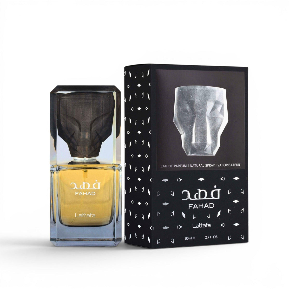 Fahad Lattafa 2D fragrance bottle with a yellow liquid and dark cap, shown next to its black packaging box with white geometric patterns.