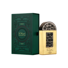
The image shows a luxurious gold perfume bottle labeled "MAHARJAN GOLD" by Lattafa Pride. The bottle features an intricate black and gold geometric design on the front, with a distinctive rounded black cap. The bottle is placed next to its matching dark 