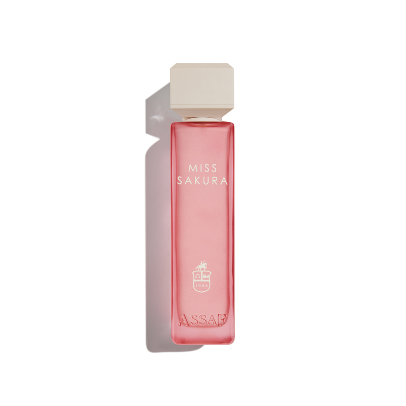Assaf Miss Sakura perfume bottle in translucent pink glass with a matching pink cap.