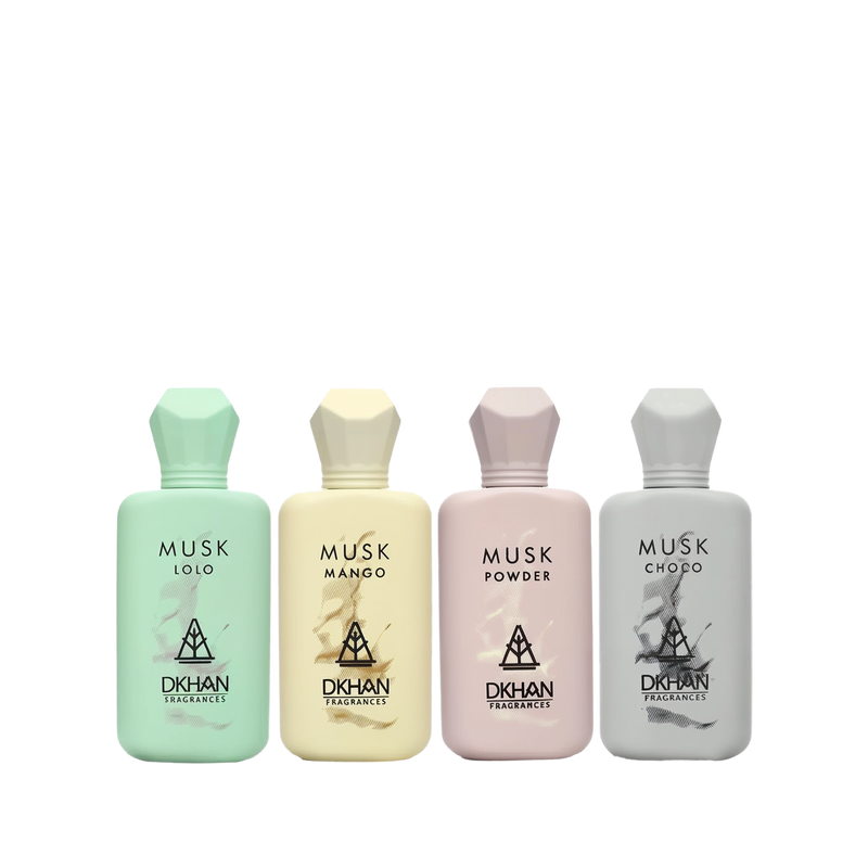 This image features a collection of four musk-inspired perfume bottles from DKHAN Fragrances, lined up against a plain background. Each bottle has a distinct pastel color and geometric cap design, corresponding to the fragrance it holds. From left to right: the first bottle is a soft mint green labeled "MUSK LOLO," the second is a gentle yellow with "MUSK MANGO," the third is a pale pink for "MUSK POWDER," and the fourth is a light grey labeled "MUSK CHOCO."