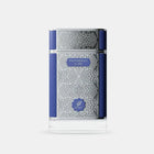 The image presents a perfume bottle with an elegant design. The bottle is clear glass with an intricate white geometric pattern covering most of its surface. It has a solid navy blue cap and a matching navy blue band that runs horizontally around the center of the bottle, providing a bold contrast to the white pattern. 