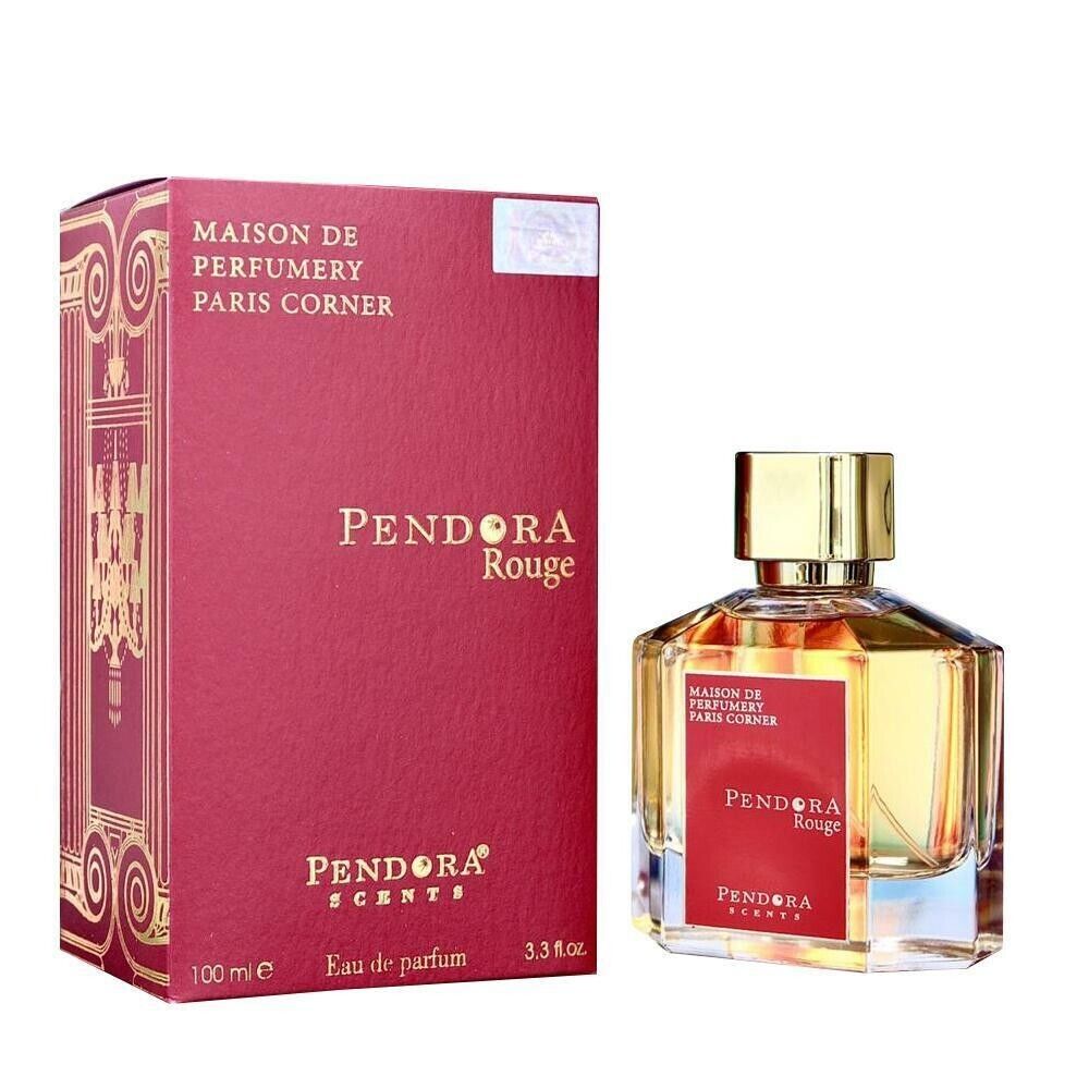 A bottle of "Pendora Rouge" eau de parfum by Pendora Scents, displayed next to its red and gold packaging. The bottle is made of clear glass with a luxurious gold cap, revealing the amber-colored fragrance inside. The label on the bottle is red, matching 