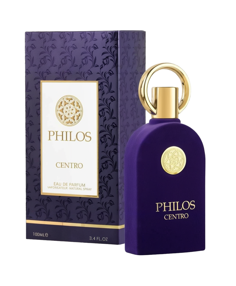 The image shows a bottle and packaging of a perfume called "Philos Centro Eau De Parfum" by Maison Alhambra. The perfume bottle is a rich purple color with a luxurious, velvety texture. It has a unique design featuring a large, round, gold-colored ring as