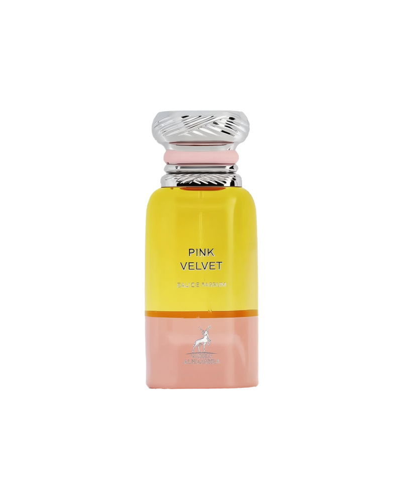 A tall, cylindrical perfume bottle with a metallic swirl cap, featuring a yellow top transitioning to a pink base, labeled ‘Pink Velvet Eau De Parfum’ by Maison Alhambra, with a deer logo at the bottom.