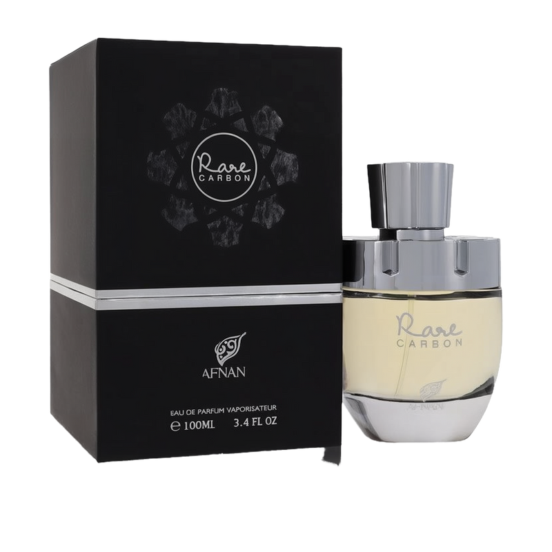 The image features a perfume product called "Rare CARBON" by AFNAN. It shows a sleek perfume bottle alongside its packaging. The bottle has a clear glass bottom where you can see the pale yellow perfume, and a metallic silver cap. The packaging is a square black box with the name "Rare CARBON" encircled by a stylized molecular design in white and grey, suggesting a theme related to carbon or elements. 