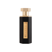 Tall black perfume bottle with gold hexagonal cap and vertical gold plaque marked Reef 19.