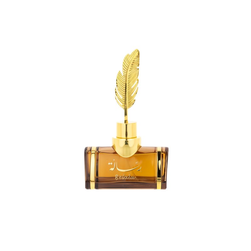 The image features an elegant, transparent amber-colored perfume bottle with a distinctive golden feather as its cap. The bottle has a robust, rectangular shape with rounded shoulders, and a gold neck that supports the feather-shaped cap, adding a luxurious touch to the design. On the front of the bottle, there is script text which appears to be a brand or perfume name, possibly in Arabic, and the word "Resala" in a stylized font.