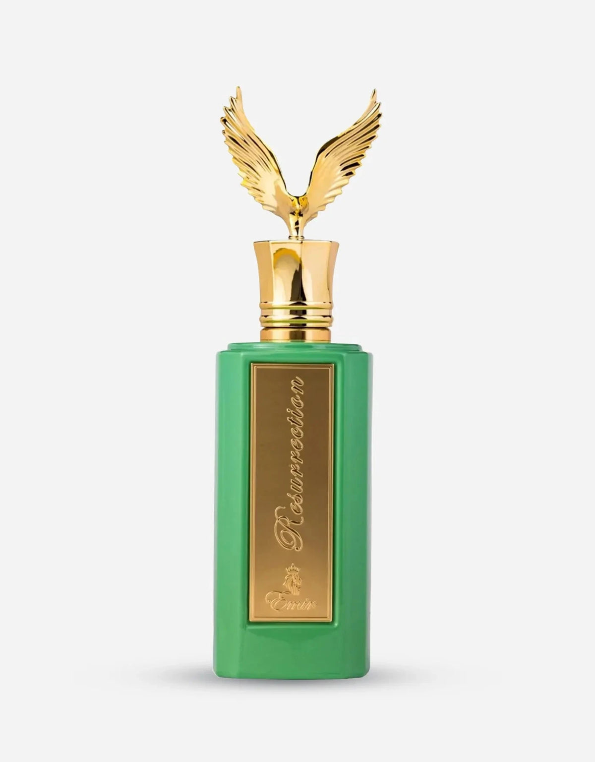 A tall, pastel-green rectangular perfume bottle with a gold plaque reading “Resurrection” in cursive, topped by a decorative gold cap featuring outspread wings.