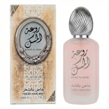 Lattafa Rouat Al Musk Fresh Hair Mist 50ml, showing the frosted pink bottle with a silver cap next to the ornate packaging box.