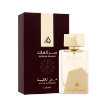 The image shows a clear perfume bottle from Lattafa with gold accents and the name "Ser Al Malik" in both Arabic and English. The bottle features a unique design with a large geometric gold cap and a matching gold label at the bottom. The text "Attar Al G